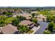 Aerial view of home near a beautiful golf course with mature trees and desert landscaping at 723 E Gemini Pl, Chandler, AZ 85249