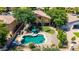 Inviting backyard featuring a swimming pool, mature trees, and manicured lawn at 723 E Gemini Pl, Chandler, AZ 85249