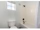 Clean bathroom with a tub-shower, and a bright window at 723 E Gemini Pl, Chandler, AZ 85249