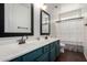 The bathroom features teal cabinets, double sinks, and bronze fixtures, creating a stylish space at 723 E Gemini Pl, Chandler, AZ 85249
