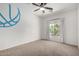 A well-lit room with a ceiling fan, a window, and a basketball wall decal at 723 E Gemini Pl, Chandler, AZ 85249