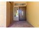 Inviting front entryway with decorative door, sidelight window, and a security camera above at 723 E Gemini Pl, Chandler, AZ 85249