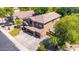 Aerial view showcasing the exterior of a home with three car garage and mature trees at 723 E Gemini Pl, Chandler, AZ 85249