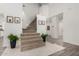 Spacious foyer features a carpeted staircase, wood-look flooring, and elegant decor at 723 E Gemini Pl, Chandler, AZ 85249