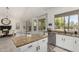 Open kitchen with granite island and breakfast bar, connected to the dining area at 723 E Gemini Pl, Chandler, AZ 85249