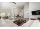 Expansive living room with a high ceiling, fireplace, staircase and seamless open layout at 723 E Gemini Pl, Chandler, AZ 85249