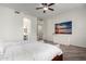 Bright main bedroom features an ensuite bathroom and a decorative painting on the wall at 723 E Gemini Pl, Chandler, AZ 85249