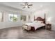 Spacious main bedroom featuring wood-look floors, neutral walls, large windows, and decorative touches at 723 E Gemini Pl, Chandler, AZ 85249