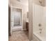 Bathroom with a tub/shower combo and tile flooring at 7419 W Raymond St, Phoenix, AZ 85043