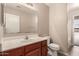 Bathroom with a vanity, toilet and mirror at 7419 W Raymond St, Phoenix, AZ 85043