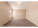 Bedroom featuring neutral carpet, recessed lighting, and a large window at 7419 W Raymond St, Phoenix, AZ 85043