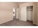 Comfortable bedroom with carpeting and a spacious closet at 7419 W Raymond St, Phoenix, AZ 85043