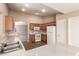 The eat-in kitchen offers light cabinets, stainless steel sink, and ample counter space at 7419 W Raymond St, Phoenix, AZ 85043