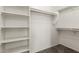 Spacious walk-in closet with shelving and rod for ample storage at 7419 W Raymond St, Phoenix, AZ 85043