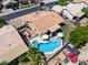 Aerial view highlighting a pool, outdoor kitchen, and patio area, creating an ideal entertainment space at 7736 W Tumblewood Dr, Peoria, AZ 85382