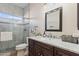 Bathroom featuring a marble countertop vanity and tiled glass enclosed shower at 7736 W Tumblewood Dr, Peoria, AZ 85382