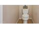 A clean, well-maintained toilet in a neutral-toned bathroom offers functionality and simple design at 7736 W Tumblewood Dr, Peoria, AZ 85382