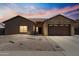 Charming single-story home with desert landscaping and a two-car garage, perfect for comfortable living at 7736 W Tumblewood Dr, Peoria, AZ 85382