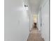 Hallway with tiled floors and lighting fixtures at 7736 W Tumblewood Dr, Peoria, AZ 85382