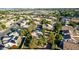 Expansive aerial showcasing a neighborhood with mature trees and a variety of well-kept residences at 780 W Morelos Ct, Chandler, AZ 85225