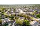 Expansive aerial view of a neighborhood featuring homes with pools and mature trees at 780 W Morelos Ct, Chandler, AZ 85225