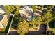 An aerial view of the backyard with mature trees, pool, spa, and covered patio at 780 W Morelos Ct, Chandler, AZ 85225