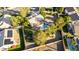 Aerial shot displaying a home with a backyard pool, covered patio, and green lawn at 780 W Morelos Ct, Chandler, AZ 85225