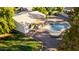 Aerial view showcasing a landscaped backyard with a swimming pool, spa, and covered patio at 780 W Morelos Ct, Chandler, AZ 85225