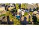 Stunning aerial view of a private backyard featuring a pool, spa, and mature trees at 780 W Morelos Ct, Chandler, AZ 85225