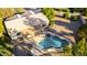 Aerial shot showcasing a landscaped backyard with a swimming pool, spa, and covered patio at 780 W Morelos Ct, Chandler, AZ 85225