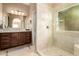 Elegant bathroom featuring granite countertops, dual sinks, and a tiled shower for a luxurious experience at 780 W Morelos Ct, Chandler, AZ 85225