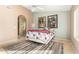 Bright bedroom with a cozy bed, stylish decor, and an ensuite bathroom, perfect for relaxation and convenience at 780 W Morelos Ct, Chandler, AZ 85225