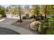 Charming single-story home with a well-manicured front yard and a two-car garage at 780 W Morelos Ct, Chandler, AZ 85225
