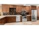 Modern kitchen with stainless steel appliances, custom cabinets, and stylish backsplash details at 780 W Morelos Ct, Chandler, AZ 85225