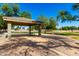 Community park featuring covered pavilion with picnic table, a playground, basketball courts and plenty of green space at 780 W Morelos Ct, Chandler, AZ 85225