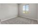 Compact bedroom with plush carpet, neutral walls, and a sunny window, designed for relaxation and rest at 9366 E Sequence Ave, Mesa, AZ 85212