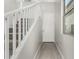Bright entryway with wood look tile flooring, stairs, and white trim at 9366 E Sequence Ave, Mesa, AZ 85212