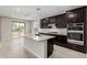 Modern kitchen showcasing a large island, stainless steel appliances, and ample counter space at 9366 E Sequence Ave, Mesa, AZ 85212