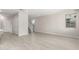 Spacious living room featuring sleek wood-look tile floors and natural light at 9366 E Sequence Ave, Mesa, AZ 85212