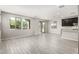 Bright living room with light tile floors and sliding glass doors to the outside at 9366 E Sequence Ave, Mesa, AZ 85212