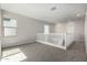 Open loft area with neutral carpet and great natural light at 9366 E Sequence Ave, Mesa, AZ 85212