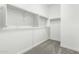An empty walk-in closet with shelving and carpet, offering potential for organized storage solutions at 9366 E Sequence Ave, Mesa, AZ 85212