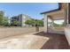Backyard featuring a block wall and covered patio of a multi-story home at 9416 E Sequence Ave, Mesa, AZ 85212