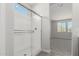 Sleek bathroom showcases walk-in shower with a frameless glass door and natural light at 9416 E Sequence Ave, Mesa, AZ 85212