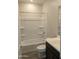 Bright bathroom with a shower/tub combo, modern fixtures, and tile flooring at 9416 E Sequence Ave, Mesa, AZ 85212
