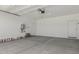 Spacious garage interior with sealed concrete floors and room for multiple vehicles at 9416 E Sequence Ave, Mesa, AZ 85212