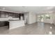 Open concept living space features a chef's kitchen with center island and breakfast bar at 9416 E Sequence Ave, Mesa, AZ 85212