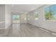 Spacious living room features neutral paint, recessed lighting, and sliding glass door at 9416 E Sequence Ave, Mesa, AZ 85212