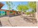 Backyard featuring a covered patio and a mix of young and mature trees at 11030 N 47Th Ave, Glendale, AZ 85304