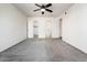 Carpeted bedroom featuring a ceiling fan and closet access at 11030 N 47Th Ave, Glendale, AZ 85304